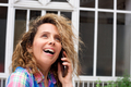 Close up happy woman talking with cellphone outside and looking away - PhotoDune Item for Sale