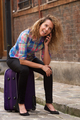 smiling travel woman sitting on suitcase talking with mobile phone - PhotoDune Item for Sale