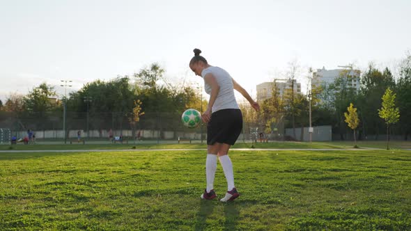 Portrait of Woman Football Soccer Player in Full Growth in the Park