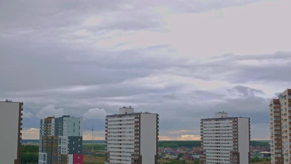 Time Lapse Rain Clouds Float Over the City Dusk is Approaching the City