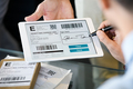 Man signing delivery receipt on digital tablet - PhotoDune Item for Sale