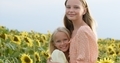 Happy smiling female kids stand in sunflowers field - PhotoDune Item for Sale