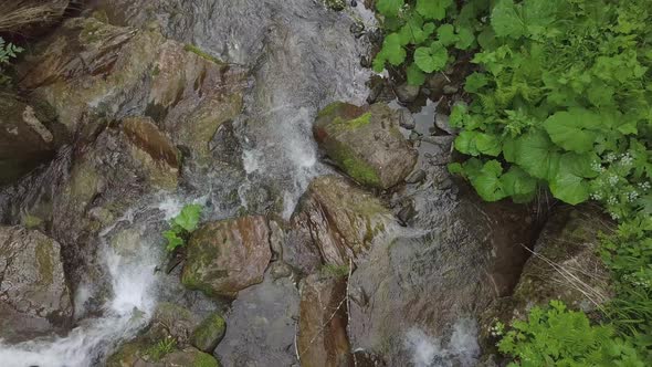 Topview of Water Moveing Down at Small Waterfall