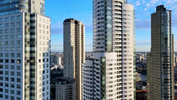 Aerial dolly in towards skyscrapers at Puerto Madero, Buenos Aires. High-rise apartment buildings