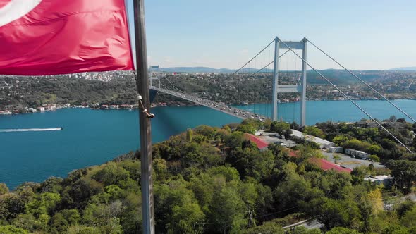 Aerial view of Fatih Sultan Mehmet Bridge and Turkish Flag