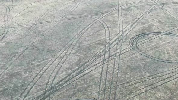 Background From Aerial Drone Shot of Car Wheel Trasses on the Bottom of Dried Lake Koktebel Crimea