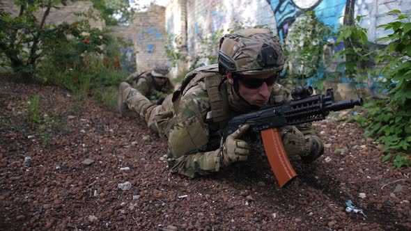 Army Rangers Crawling Toward Enemy Position