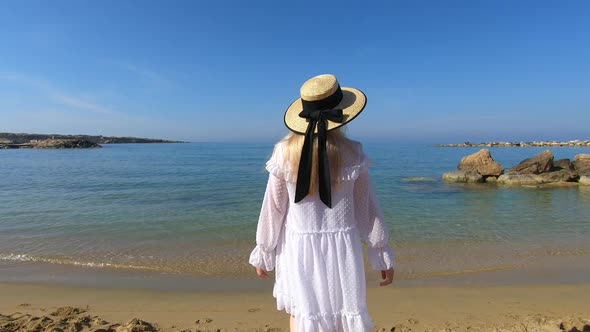 Woman Travel to Cyprus and Relax Near Coral Bay Beach