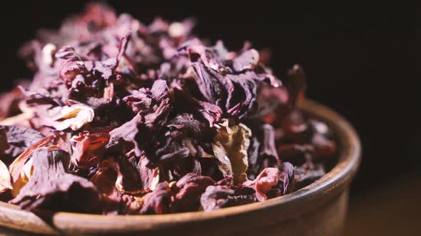 Large Leaves of Hibiscus Red Dry Tea Background, Close Up. Loop Rotation.