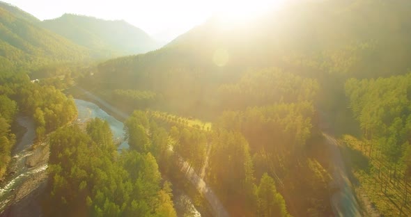 Low Altitude Flight Over Fresh Fast Mountain River with Rocks at Sunny Summer Morning.