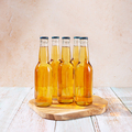Beer bottles on wooden podium on table - PhotoDune Item for Sale