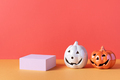 Empty product podium with Halloween pumpkin decor in pastel pink and orange colors - PhotoDune Item for Sale
