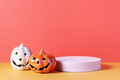Empty product podium with Halloween pumpkin decor in pastel pink and orange colors - PhotoDune Item for Sale