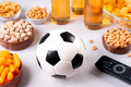 Beer and snack on gray table with football ball, football game night food, copy space - PhotoDune Item for Sale