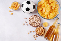 Beer and snack on gray table with football ball, football game night food, copy space - PhotoDune Item for Sale