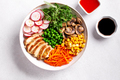 Chicken buddha bowl with meat, colorful vegetables on base of brown rice. - PhotoDune Item for Sale