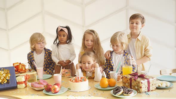 Happy Diverse Joyful Kids in Birthday Caps Celebrate Birthday