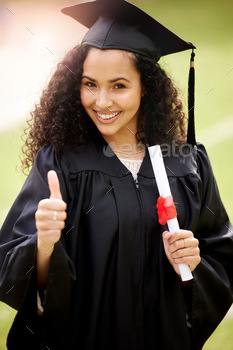 showing thumbs up on graduation day