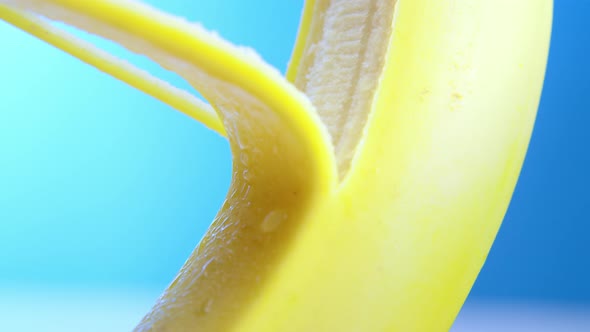 Macro Lens Shot Fresh Banana Gets Peeling on a Blue Background