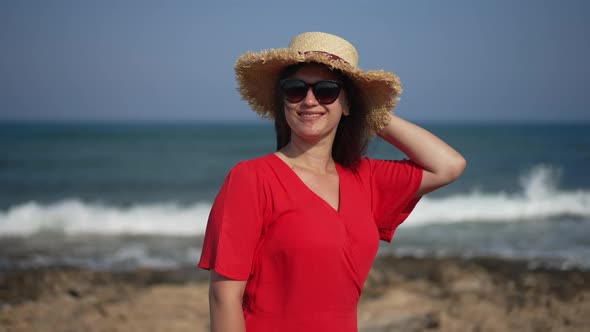 Medium Shot Happy Smiling Young Woman in Sunglasses and Straw Hat Looking at Camera Posing at