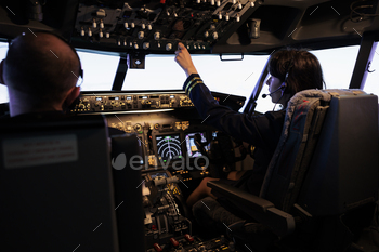 Captain and copilot switching power engine buttons on dashboard