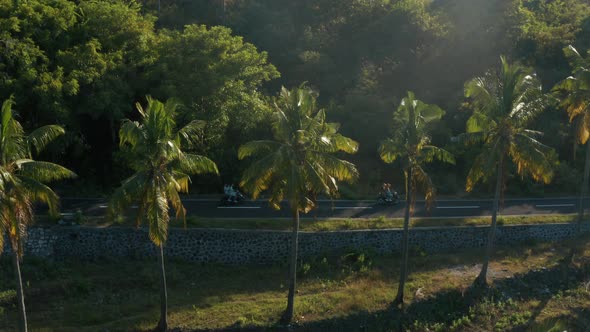 Aerial footage of people is driving the motorbike in Nusa Penida Island. 2 motorbikes.