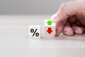  rates concept with percentage symbol and up down arrow symbol on the wooden cube