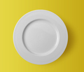 white ceramic plate on yellow background - PhotoDune Item for Sale