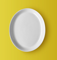 white ceramic plate on yellow - PhotoDune Item for Sale