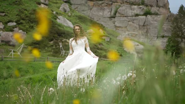Beautiful Bride in Fashion Wedding Dress on Natural Background
