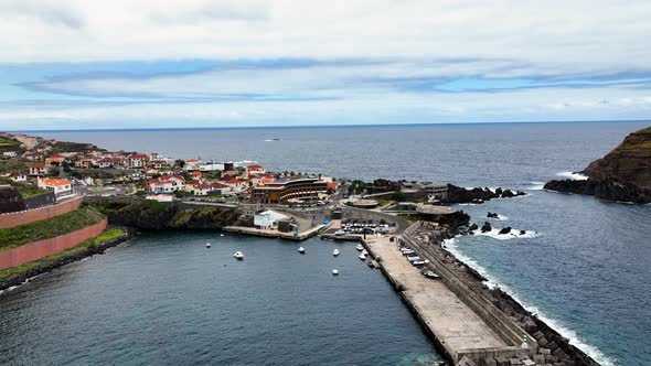 Harbour at touristic Porto Moniz, Madeira; drone trucking right shot