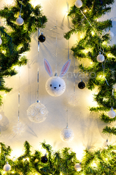  hanging on the christmas tree. Happy Chinese new year of the rabbit zodiac sign. Symbol of the year 2023.