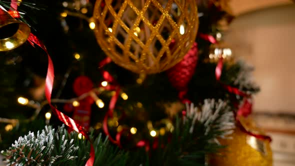 Mans hand put ball on christmas tree