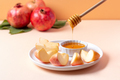 Closeup of plate with apples and honey for Jewish holiday Rosh Hashanah - PhotoDune Item for Sale