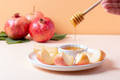 Closeup of plate with apples and honey for Jewish holiday Rosh Hashanah - PhotoDune Item for Sale