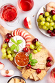 Healthy mediterranean cheese and fruits board with rose wine on light background - PhotoDune Item for Sale