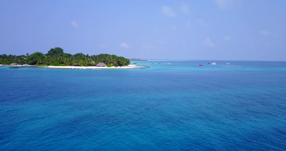 Daytime fly over abstract view of a sandy white paradise beach and aqua blue ocean background in bes