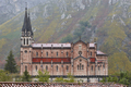 Picturesque red stone basilica and mountains in Covadonga. Cangas, Asturias - PhotoDune Item for Sale