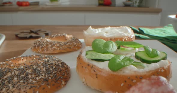 Woman Cooks Bagels with Cottage Chese Salad and Salami at the Home Kitchen  60p Prores