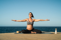 Young pregnant woman doing yoga session next the sea - Meditation and maternity concept - PhotoDune Item for Sale