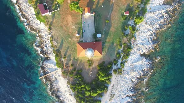 Flying over lighthouse, Croatia with a red tiled roof