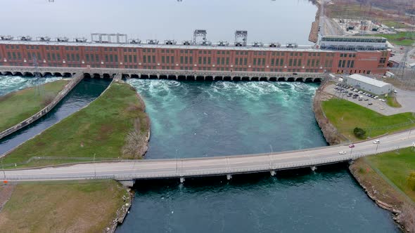 4K aerial view of a Hydroelectric Generating Station on the Saint Lawrence River, in Quebec, Canada.