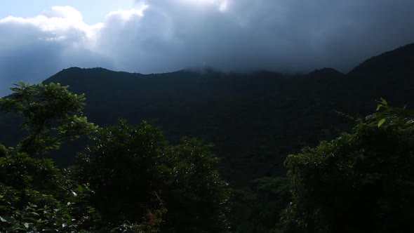 Storm clouds in sunrise summer mountains