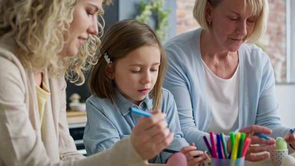 Close up video of women painting Easter eggs at home, Shot with RED helium camera in 8K