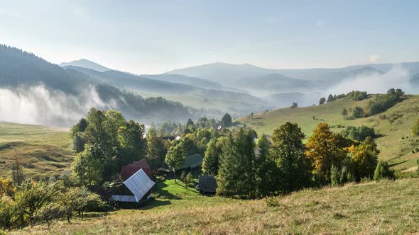 Foggy Clouds Moving over Rural Countryside Landscape in Sunny Autumn Morning Nature