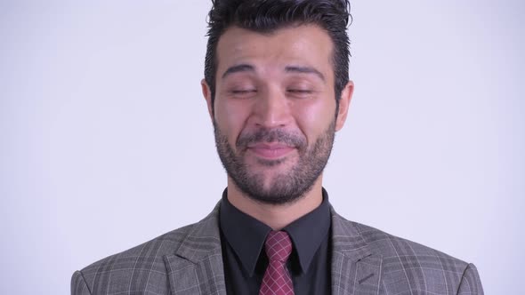 Face of Happy Bearded Persian Businessman Smiling