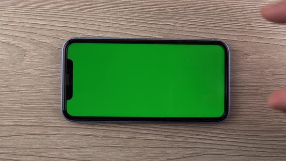 Smartphone with Green Screen Mockup Zoom Hand Close Up Mobile Phone User