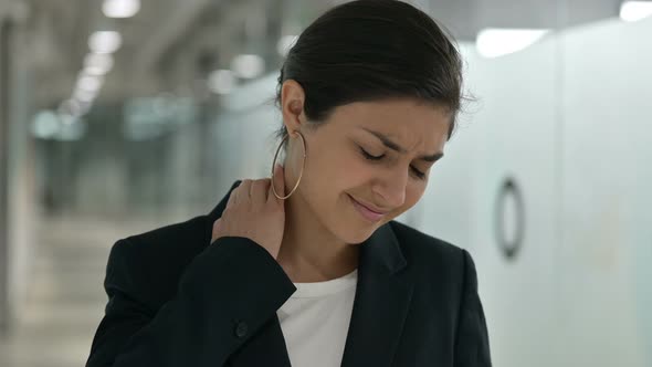 Stressed Indian Businesswoman Having Neck Pain 