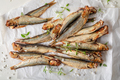 Salty smoked sprats as appetizer by the sea. - PhotoDune Item for Sale