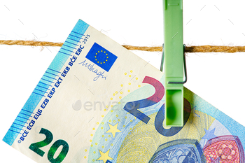 ite background. Euro money on rope isolated on white background. Money laundering concept
